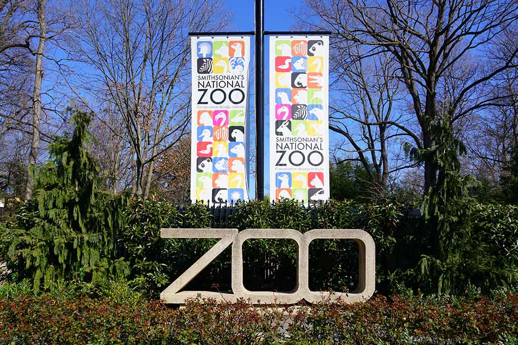 Smithsonian's National Zoo entrance with colorful banners.