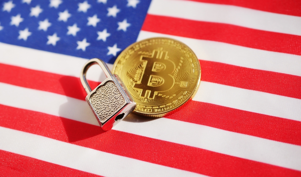 Bitcoin and padlock on American flag.