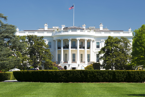 The White House with American flag above it.
