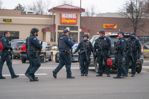 Police officers gathered outside King Soopers grocery store.