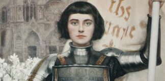 Portrait of Joan of Arc in medieval armor holding a sword