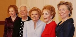 Five former First Ladies of the United States posing together at a formal event
